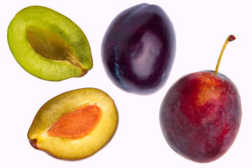 Isolated plums. One and a half of blue plum fruit isolated on white background