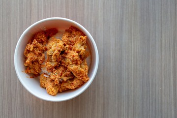 spicy pieces of chicken served with mixed rice.