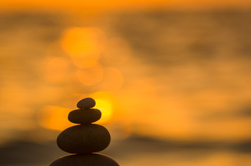 Obraz na płótnie Canvas stack of zen stones on pebble beach
