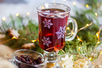 Glasses with red mulled wine  also called "Gl&uuml;hwein" or "Gl&ouml;gg" for the Christmas and winter season. Selective focus