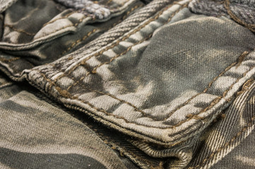 clothing items washed cotton fabric texture with seams, clasps, buttons and rivets