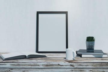 Wooden desktop with empty frame