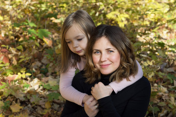 Autumn portrait mother and daughter
