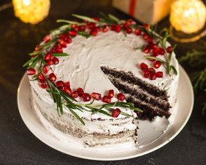 cake with pomegranate and rosemary (chocolate cake). top view.