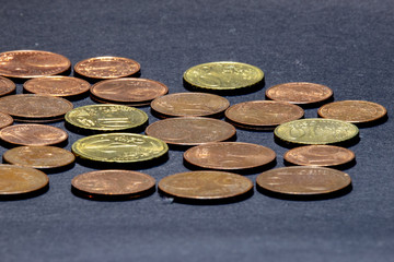  many euro cent coins for black background