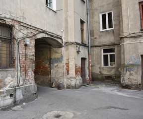 Fototapeta na wymiar Courtyard of an old house. Location: Zabkowska street, Praga district, Warsaw city, Poland