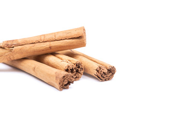 Cinnamon sticks tied with jute rope isolated on white background