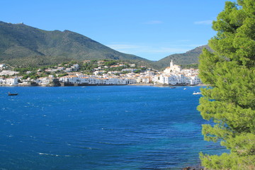 the Amazing Spain coastal village of Cadaques with a traditional boat, Mediterranean sea, the Pearl of the Costa Brava, Catalonia