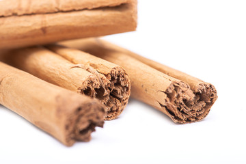 Cinnamon sticks tied with jute rope isolated on white background