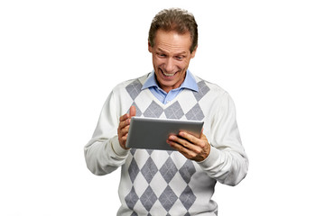 Fototapeta na wymiar Portrait of happy man with pc tablet. Cheerful middle-aged man holding digital tablet and smiling over white background.