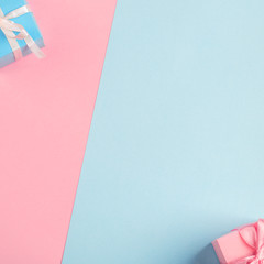 blue and pink gifts on a plain background. copy space.
