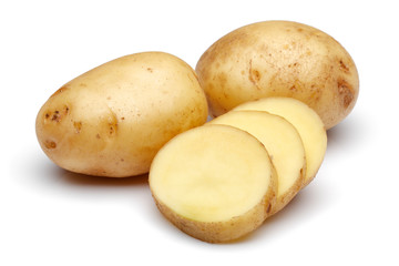 Raw potatoes and slices on white background