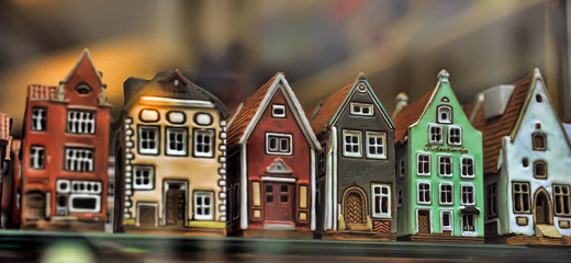 Ceramic houses candlesticks in a shop window