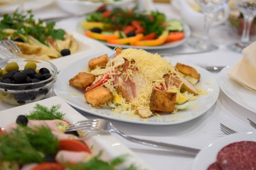 Cold dishes and snacks on the festive table. A rich luxurious meal in the restaurant. 