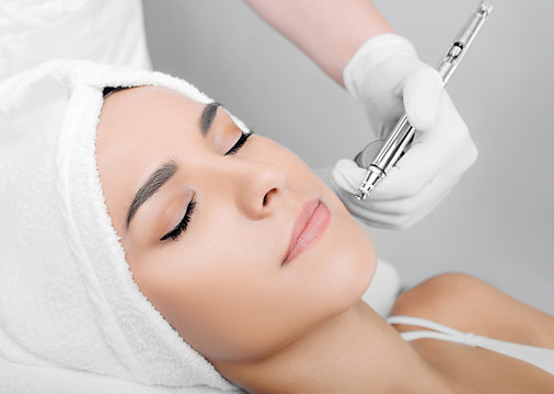 Face Of Beautiful Woman While Procedure Jet Peeling, Facial Treatment