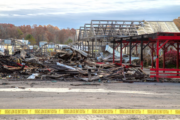 Burnt down local farmer's market days after fire.  Debris everywhere.  Property is roped off with...