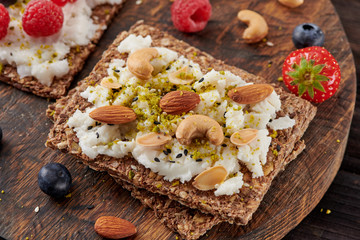 Sandwich with nuts and berrie Useful breakfast.