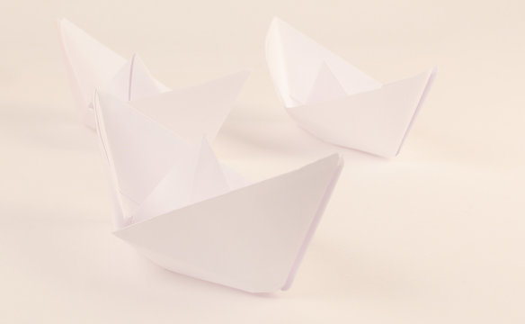 three paper boat made in the technique of origami.