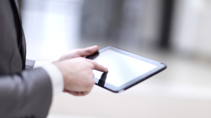 Close-up Of Businessperson Using Digital Tablet With Blank Disp