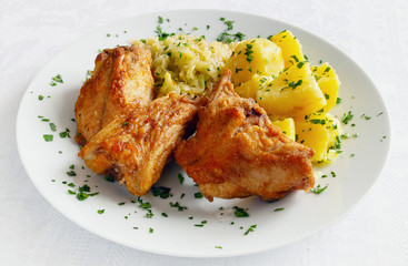 roasted rabbit chops garnished with vegetables