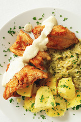 roasted rabbit chops under mustard based sauce garnished with vegetables