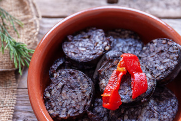 Close up of sausage casserole and red pepper