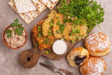Tasty Hanukkah celebration food on vintage cutting board