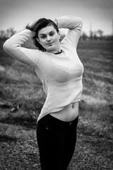 Girl with raised hands. Black and white photo