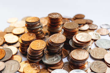 Big heap of columns of different Russian coins on white background.