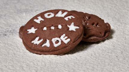 Brown gingerbread. Christmas composition on the table covered with flour. You might think that gingerbread cookies are lying on the snow.