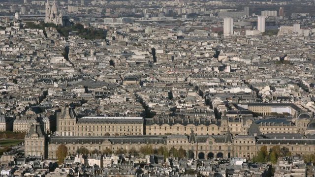 Aerial establishing shot of the Louvre in Paris. Panning left and right. daytime