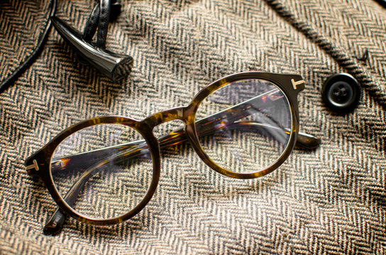 Vintage eyeglasses on tweed background