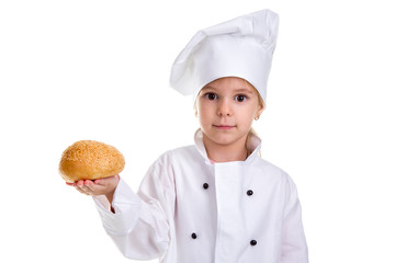 Chef girl in a cap cook uniform, holding the bread with sesame in the right hand. Looking at the camera