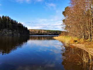 Fototapeta na wymiar Calm lake near Haltia in autumn colors