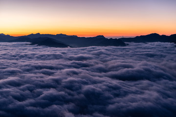 Fototapeta na wymiar Sunset over sea of fog