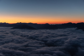 Fototapeta na wymiar Sunset over sea of fog