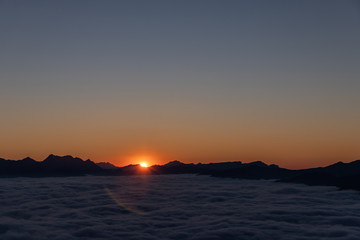 sunset over sea of clouds