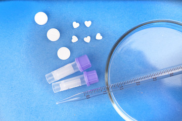 Drugs, Drugs, Doping, test tubes, Petri dish on a blue background.