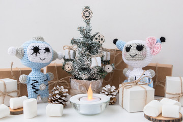 Knitted Robot. New Year's and Christmas card. Christmas tree and gifts boxes. Huggy concept. Concept. DIY.