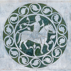 Marble decoration on the facade of San Martino Cathedral in Lucca, Tuscany, Italy.