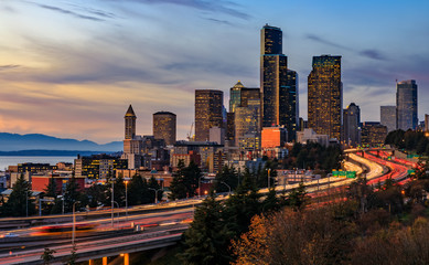 Seattle downtown skyline sunset from Dr. Jose Rizal or 12th Avenue South Bridge with traffic trail lights