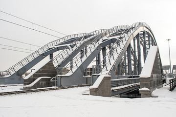 Railway bridge in the winter in the snow.