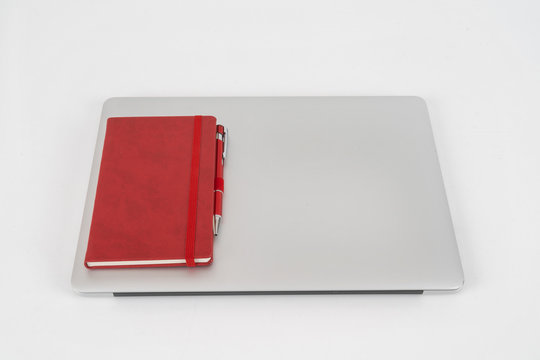 laptop and notepad on desk