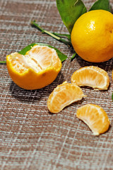 bright, juicy tangerines with green leaves. Cleaned tangerines. Vitamin C. Healthy vegetarian food.