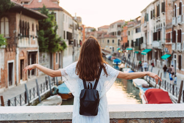 Fototapeta premium young girl walks the streets of Venice