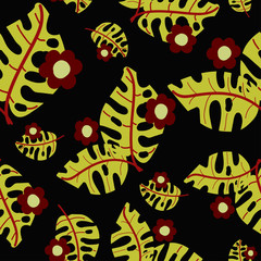 tropical  leaves with flowers on a dark color