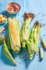 Preparations for grilling fresh corncob with salt and butter