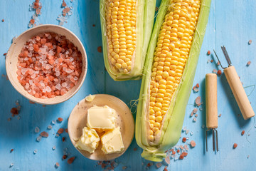 Preparations for grilling sweet corncob with butter and salt