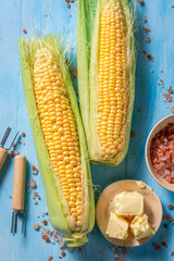 Preparations for grilling delicious corncob with salt and butter