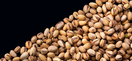 Pistachio nuts in shell. Panorama. Background. Texture.